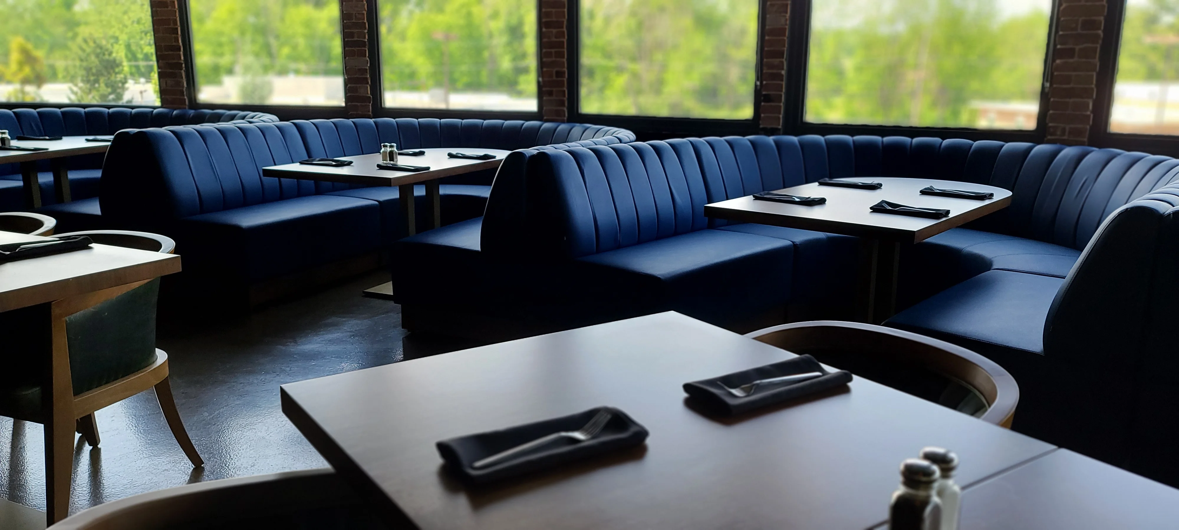 Private booth seating by the windows